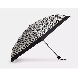 Coach black white travel compact umbrella w/pom pom wristlet